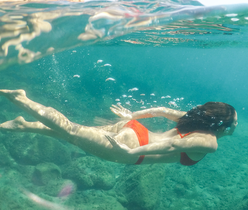 Flow Fairy Woman Swimming In Ocean with Menstrual Cup